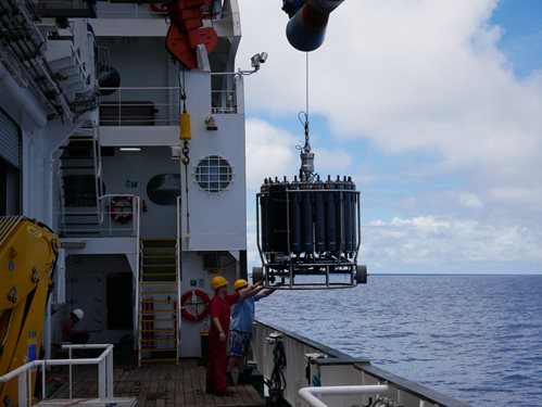 A CTD device being lifted by crane onboard